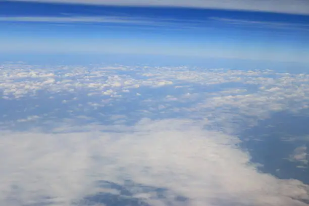 Photo of blue sky and white clouds view of airplane