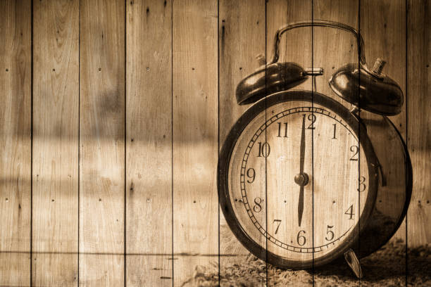 istock retro clock vintage style over wood background 871860182