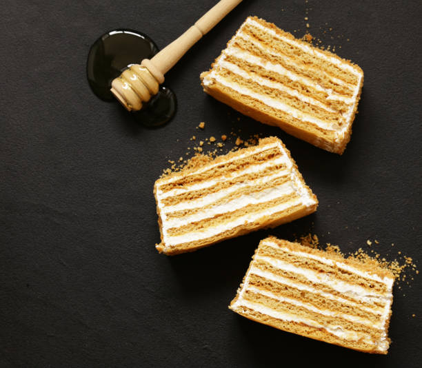 istock honey cake with butter cream on a stone board 871863684