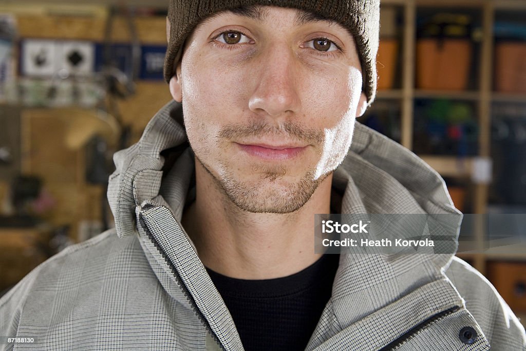 A young male skier standing in his gear room. Montana - Western USA Stock Photo