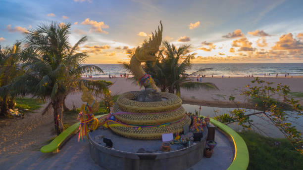 istock sunset above Naka snake sculpture at Karon beach 871881588