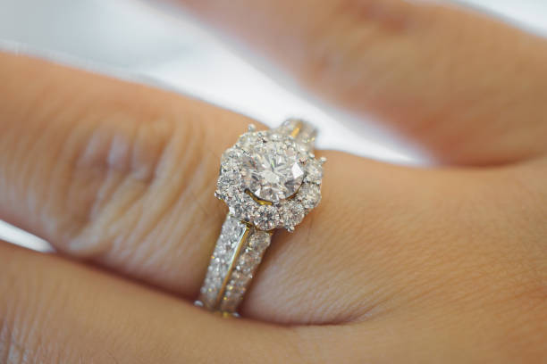 istock wedding diamond ring on woman finger 871883060
