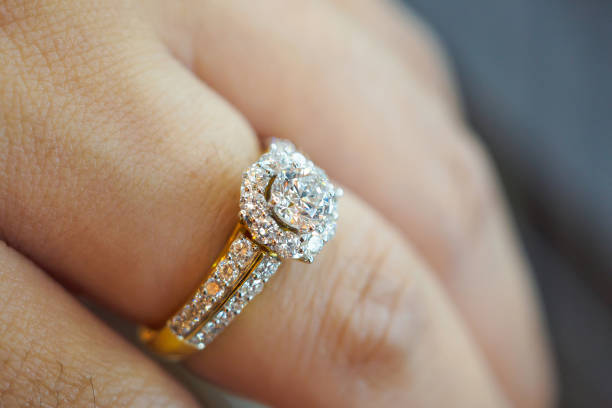 istock wedding diamond ring on woman finger 871883080
