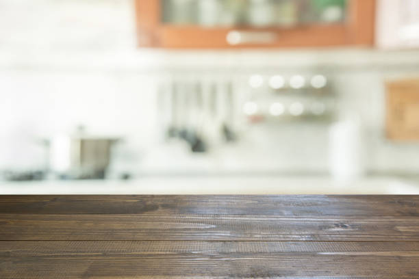 istock Blurred background. Modern kitchen with tabletop and space for you. 871885984