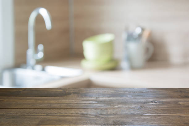istock Blurred background. Modern kitchen with tabletop and space for you. 871886374