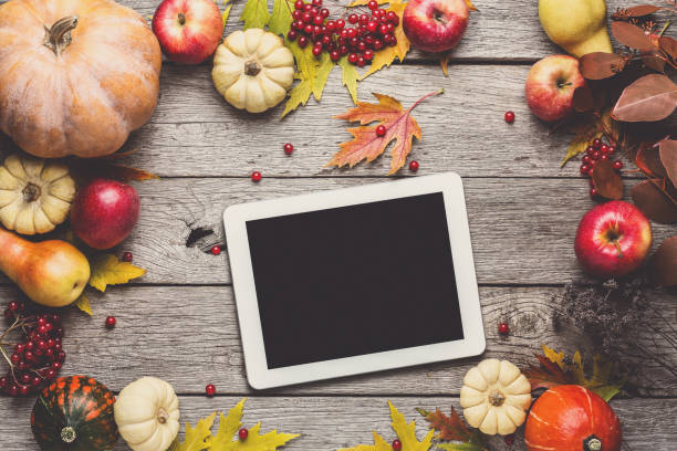 istock Seasonal background with autumn harvest and tablet 871896462