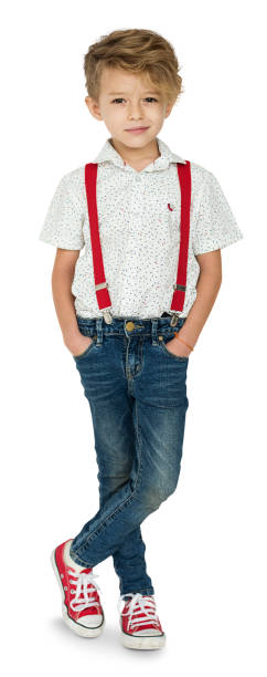 istock A Caucasian Boy Standing Crossing Legs Background Studio Portrait 871897102