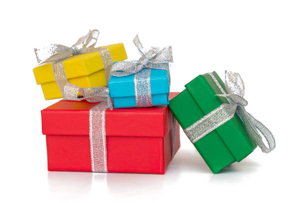 istock Gift multicolored boxes wrapped in recycled paper with ribbon isolated on white 871899600