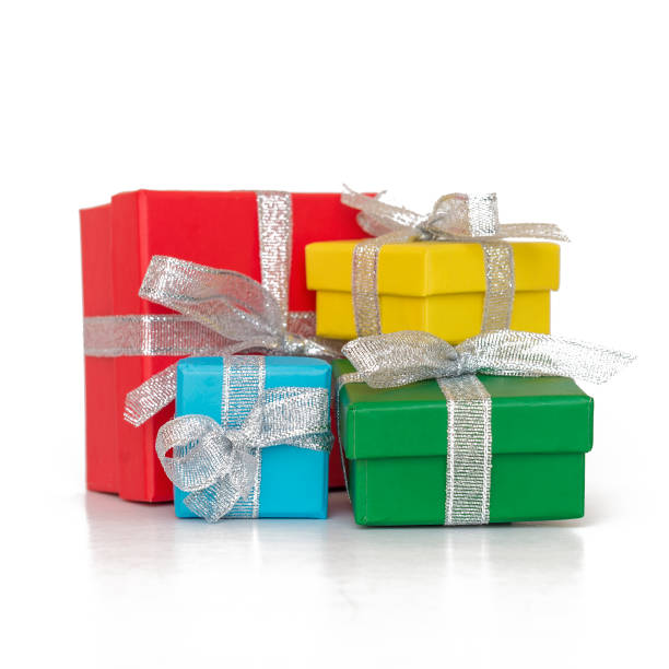 istock Gift multicolored boxes wrapped in recycled paper with ribbon isolated on white 871900128