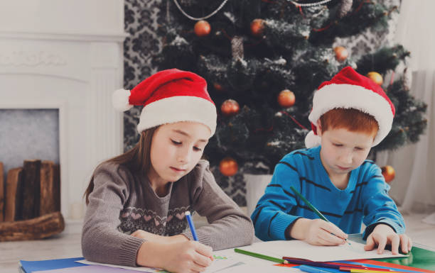 istock Children writing letter to santa, wait for christmas 871900452