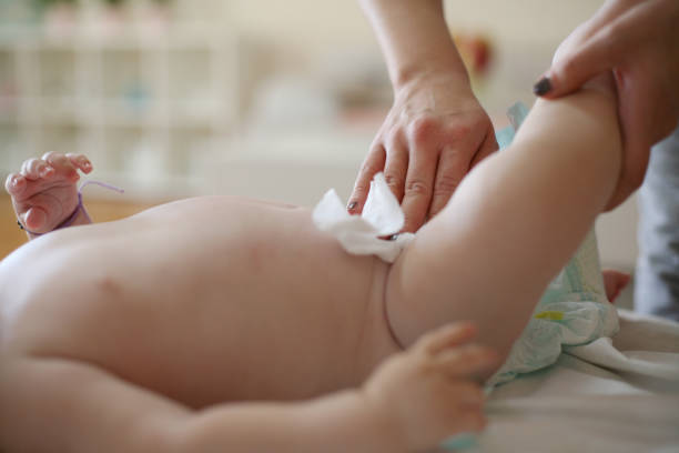 istock Mother changing diaper baby boy. Close up 871901530