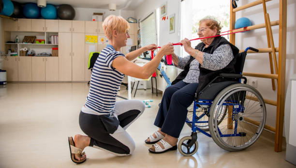 istock Caregiver Helping Senior Woman With Phisyotherapy Exercise 871901720