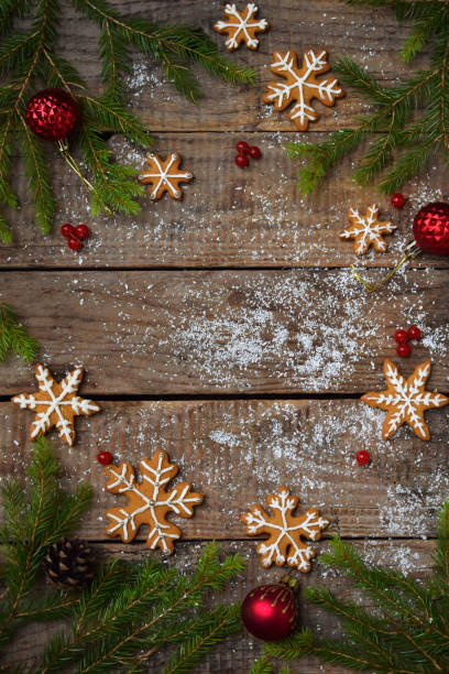 istock Christmas composition with gingerbread cookies, festive decoration, candle and fir tree branch. Holiday, New Year, Xmas concept. Vintage style. Flat lay, top view, with copy space 871904708