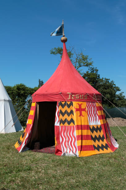 istock Red and Yellow Tent on Meadow set up for Medieval Event Fair 871905178