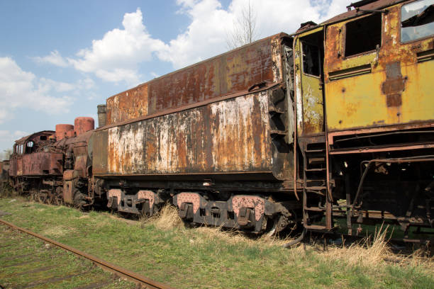 istock Old rusty locomotives and cars 871905236