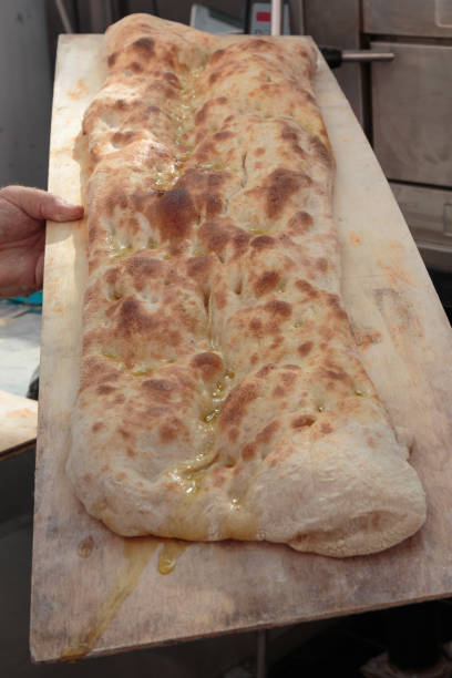 istock Italian Flat Bread with Oil on Wooden Board 871905306