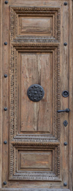 istock Old wooden brown door close-up 871905486
