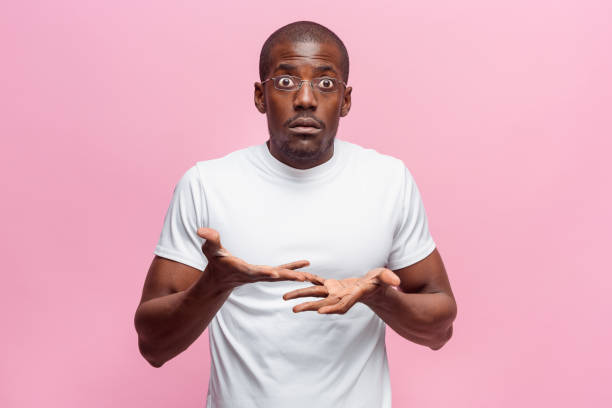 istock The portrait of handsome young surprised black african man 871908498