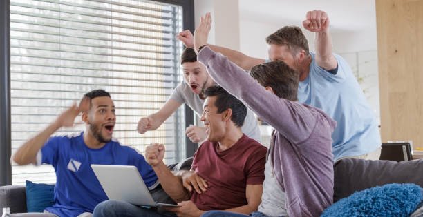 istock Friends watching football match 871915560