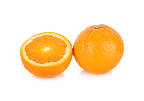 whole and half cut fresh Navel/Valencia orange on white background whole and half cut fresh Navel/Valencia orange on white background valencia orange stock pictures, royalty-free photos & images