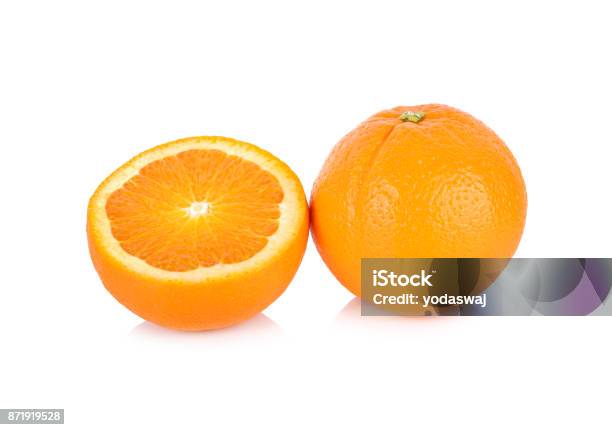Whole And Half Cut Fresh Navelvalencia Orange On White Background Stock Photo - Download Image Now