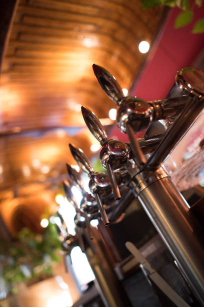 istock Waiter pours beer in a pub 871920290