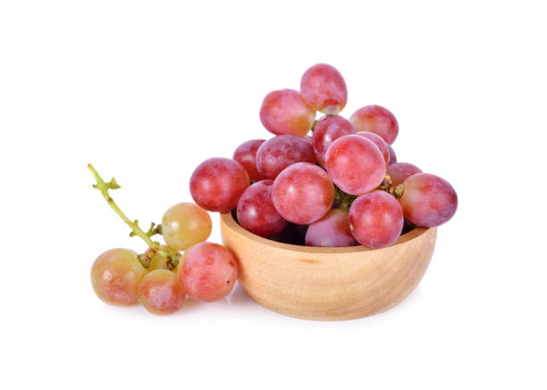 istock fresh grapes in wooden bowl and on white background 871922774