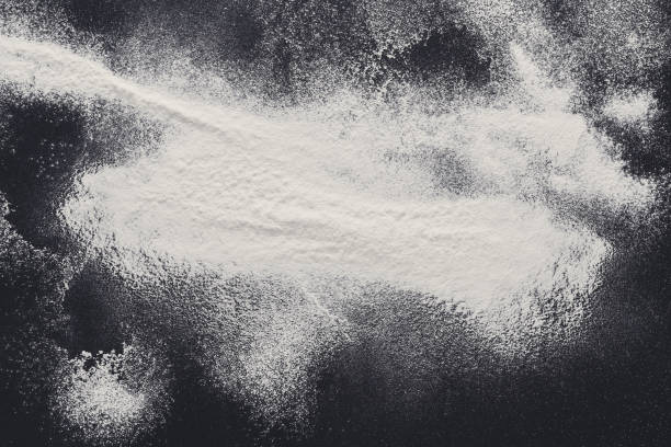 istock Baking concept on black background, sprinkled flour with copy space 871927044