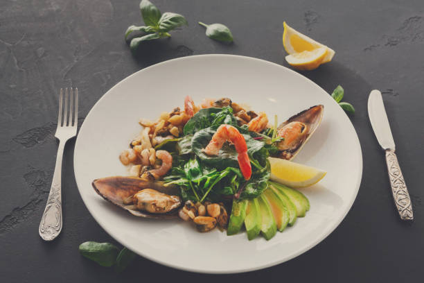istock Warm salad with grilled seafood and cutlery 871927794
