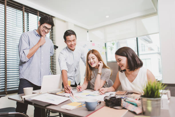 istock Young creative business people talking in office 871930414