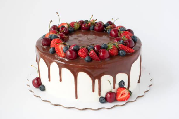istock Birthday cake in chocolate with strawberries, blueberries and cherry 871932118