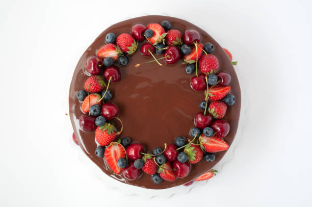 istock Birthday cake in chocolate with strawberries, blueberries and cherry 871932132