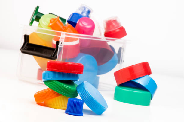 istock Plastic bottle screw caps in box isolated on white 871932136