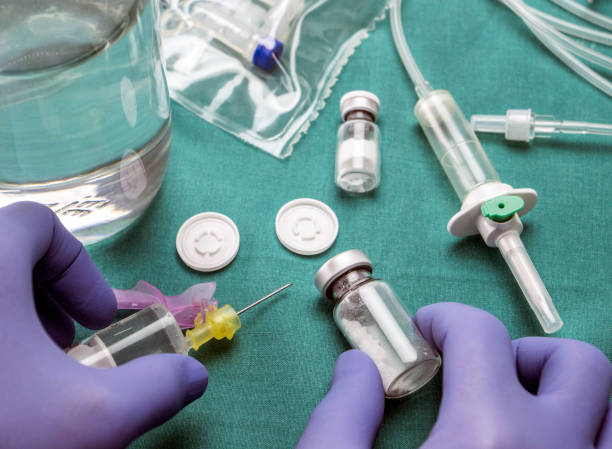 istock Doctor preparing medication to inject, conceptual image 871932644