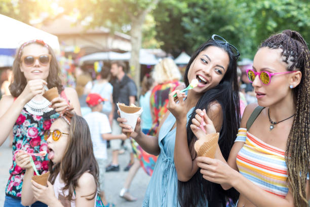 istock Girls having fun and eating ice cream 871932852