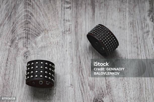Two Brown Leather Bracelets With Rivets Stock Photo - Download Image Now - Bracelet, Leather, Arts Culture and Entertainment