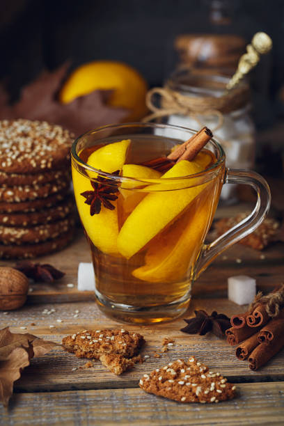 istock Autumn hot tea with lemon in glass cup. 871938740
