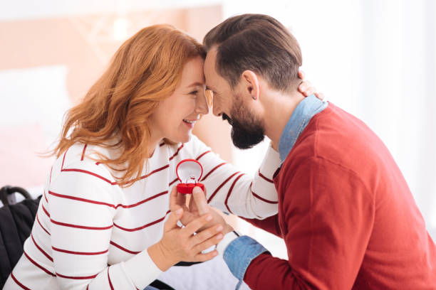 istock Happy man and woman caressing each other 871939840