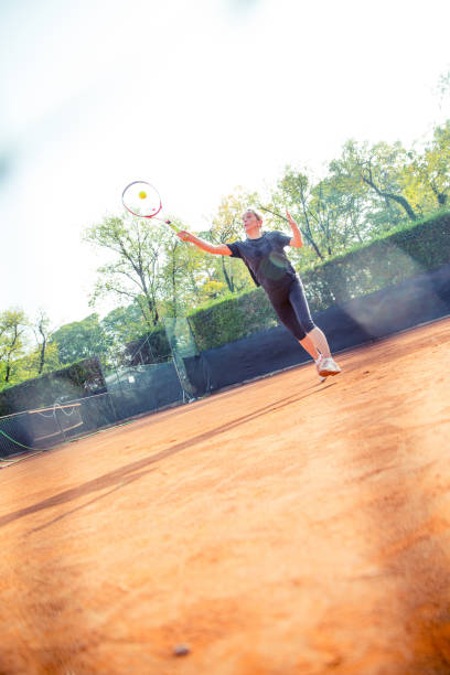 istock Female Tennis Player In Action 871943378