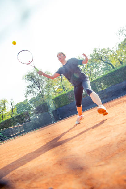 istock Female Tennis Player In Action 871943382