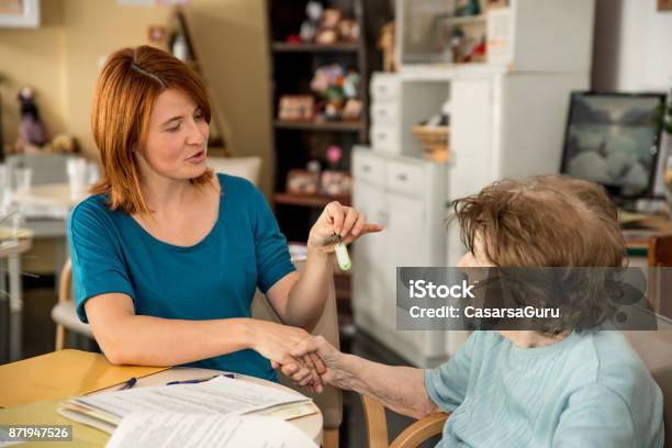 First Day At Retirement Home Stock Photo - Download Image Now - Adult, Adults Only, Assistant