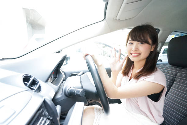 istock Young woman driving car 871951488
