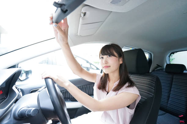 istock Young woman driving car 871951600