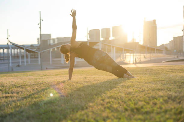 istock A Young woman doing yoga exercise outdoor 871951654