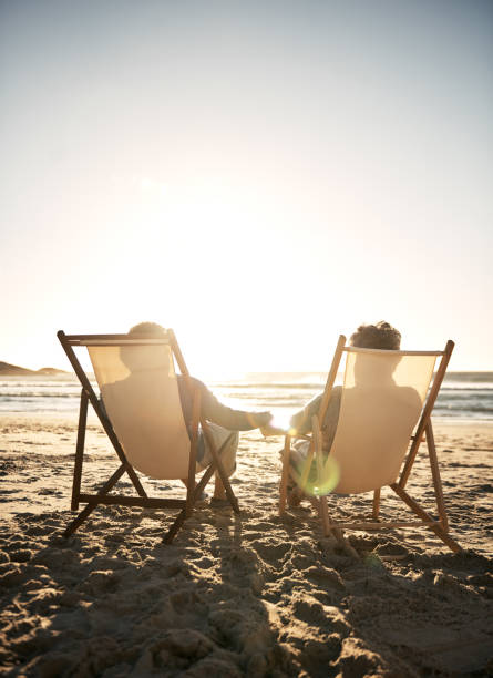 istock Hand in hand on the sand 871952074