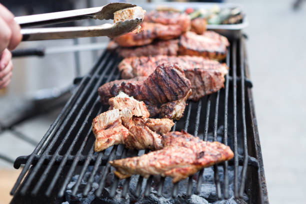 istock Pork ribs cooking on grill at bbq party 871952186