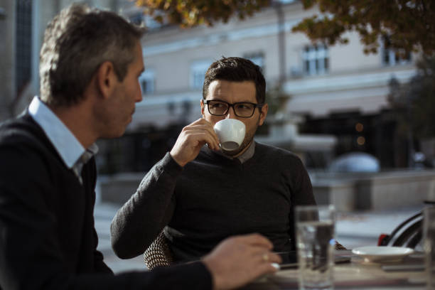 istock Businessmen people having a coffee break 871957886