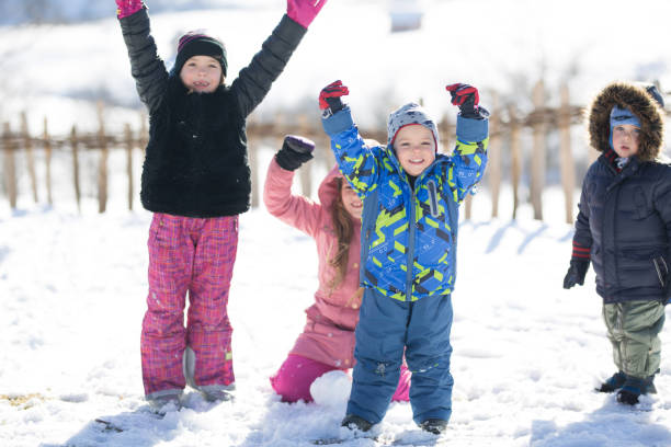 istock Kids having fun in winter . 871957988