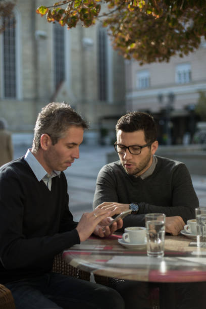 istock Businessmen people having a coffee break 871958394