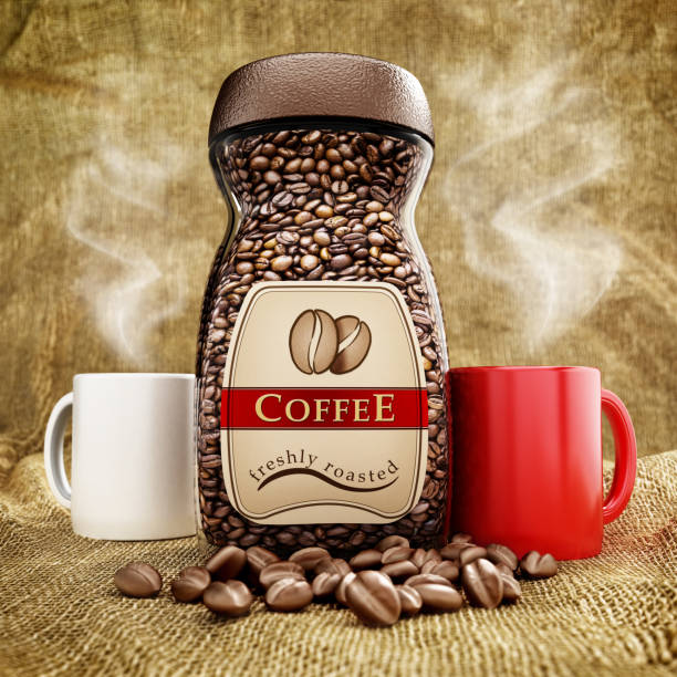 Roasted coffee bottles, coffee beans and coffee mugs standing on sackcloth.